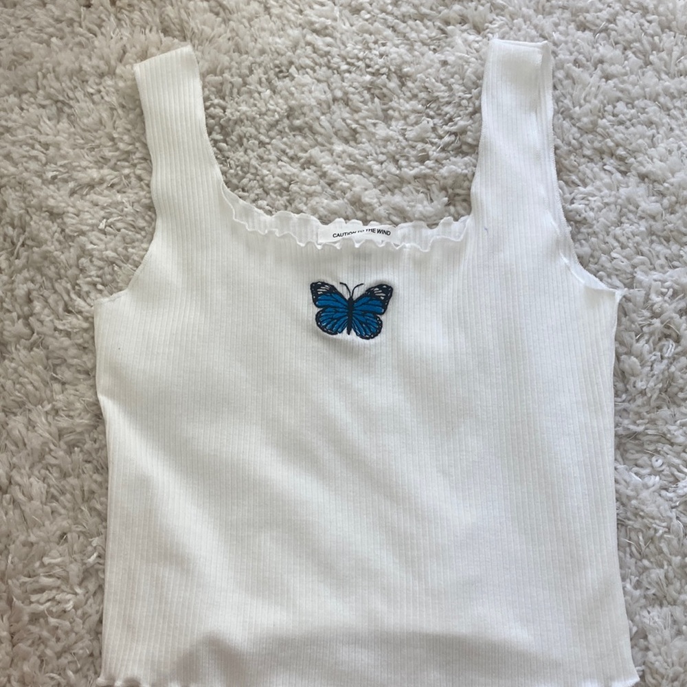 Butter fly tank top white caution to the wind